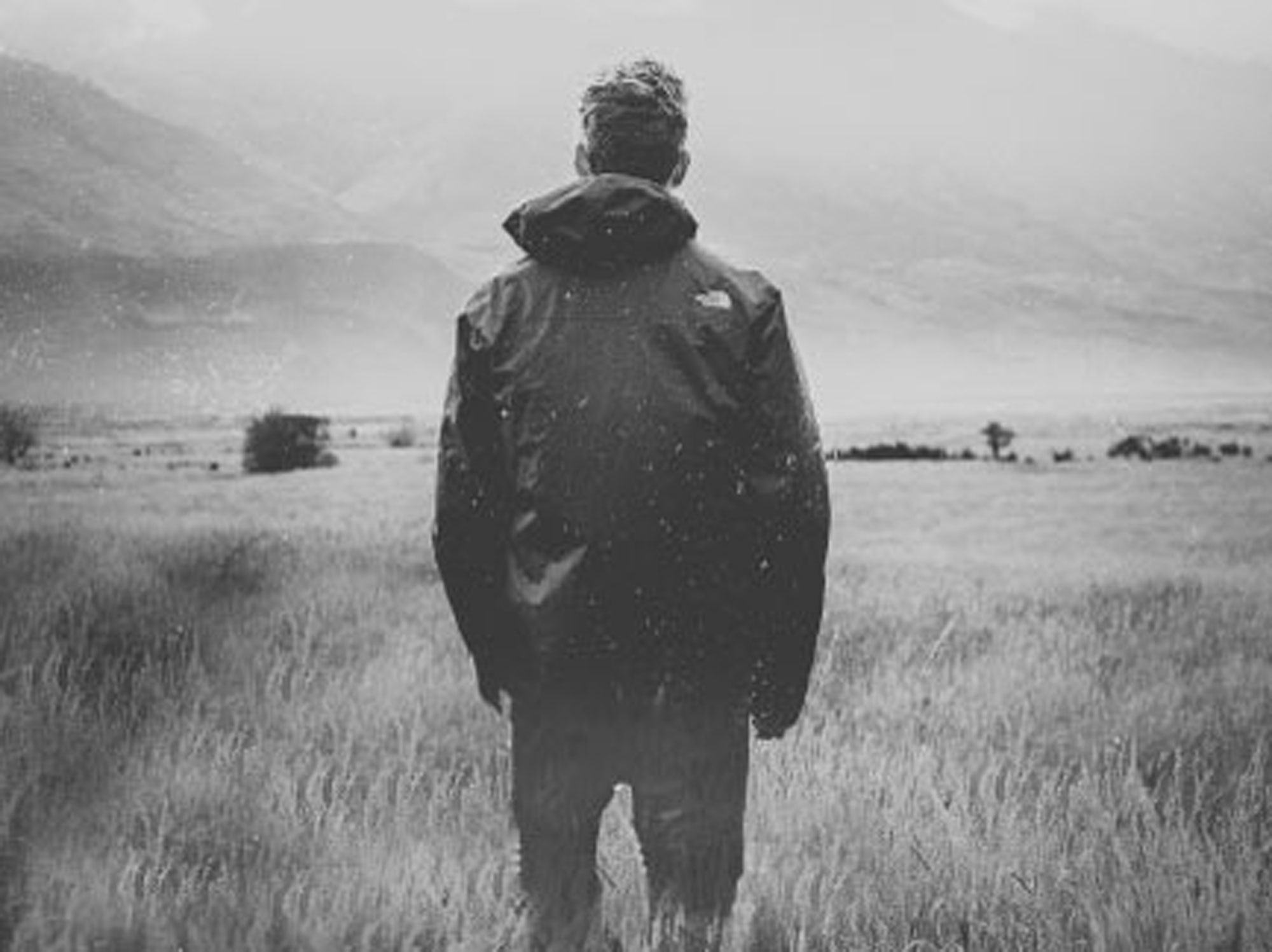 Man in field looking away